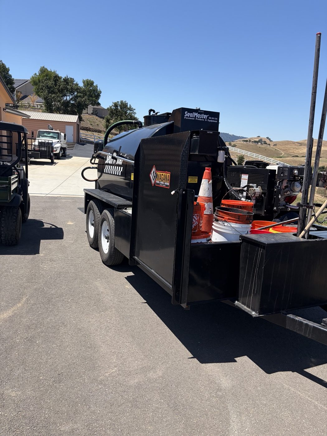 Magaña branded SealMaster seal coat trailer