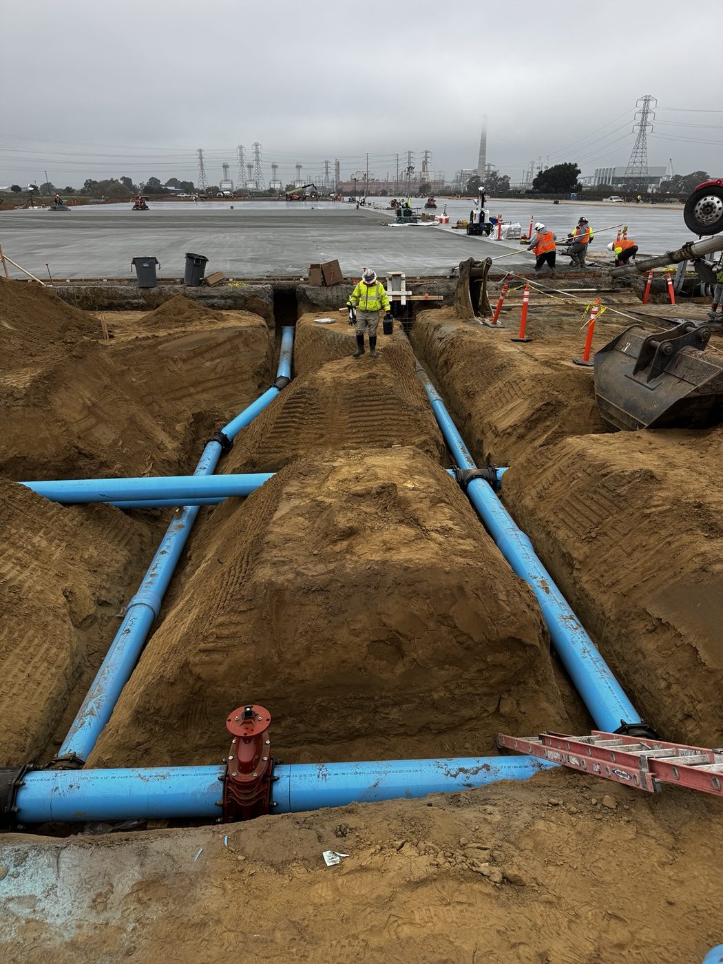 Blue waterline pipe installed in open trench